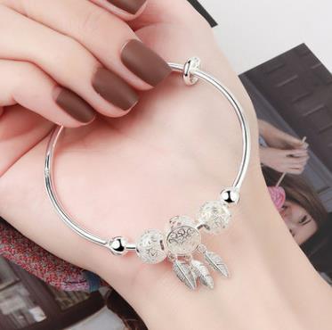 Aleación chapada en plata 999 Nicho de plata Pulsera de villa de viento frío personalizada Pulsera de plata al por mayor